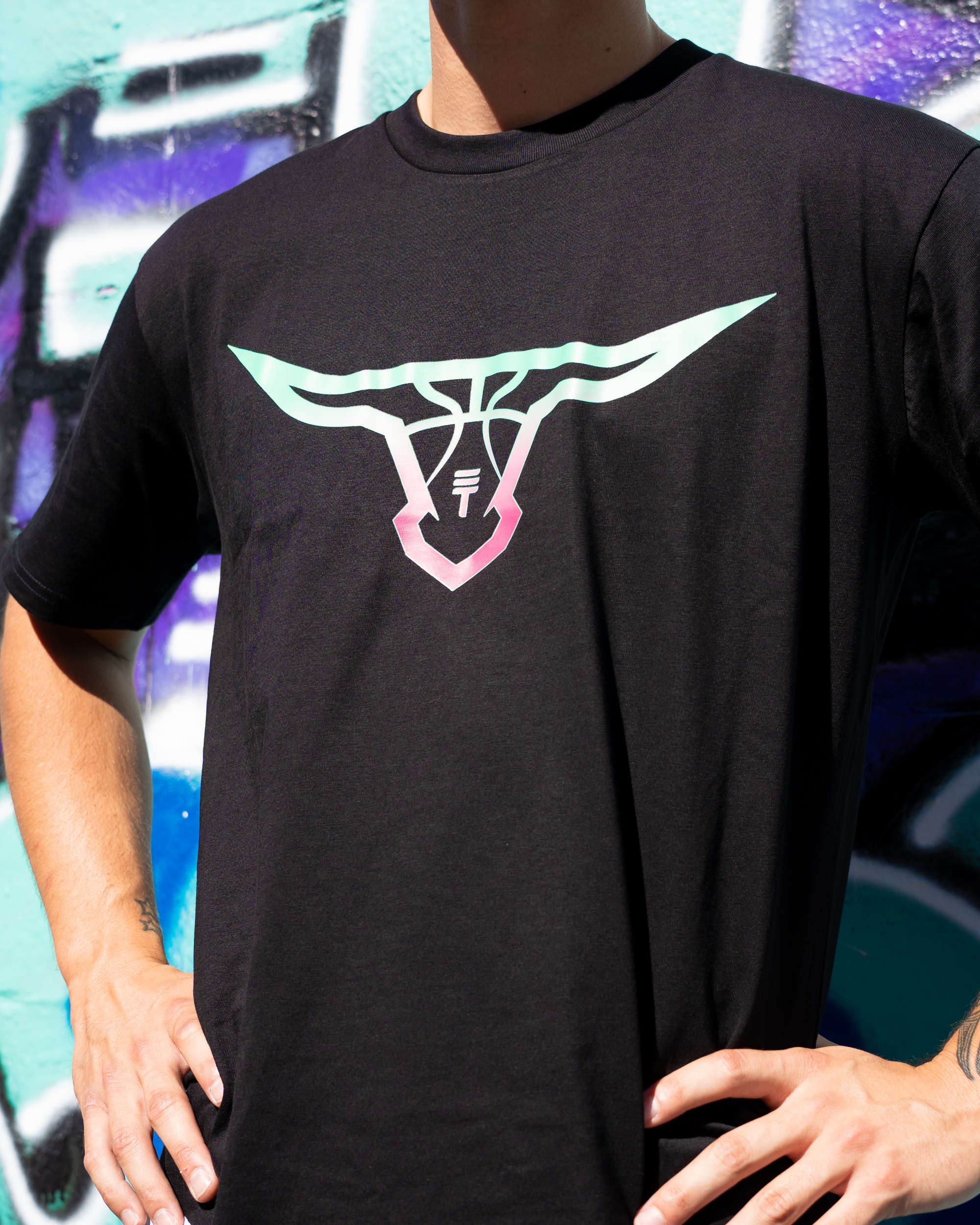 Close up of model wearing Triple Threat T-shirt