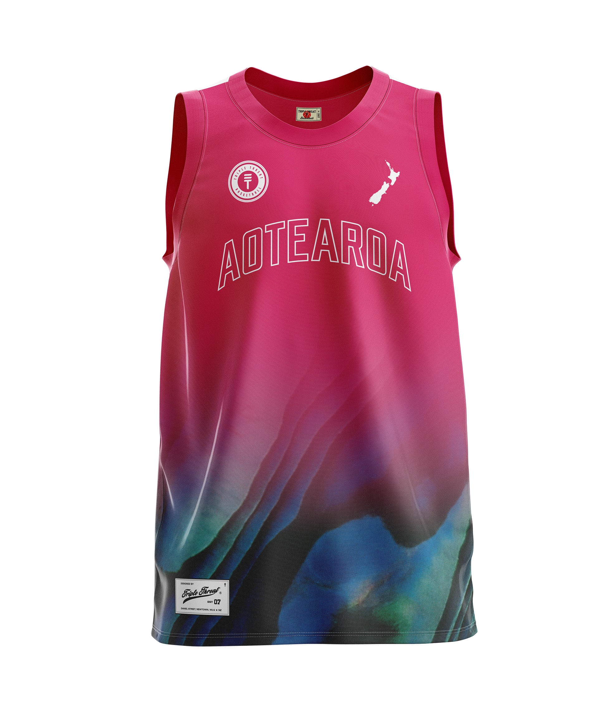 Pink basketball singlet featuring a Paua design and New Zealand map logo and Triple Threat logo and 'Aotearoa' in white