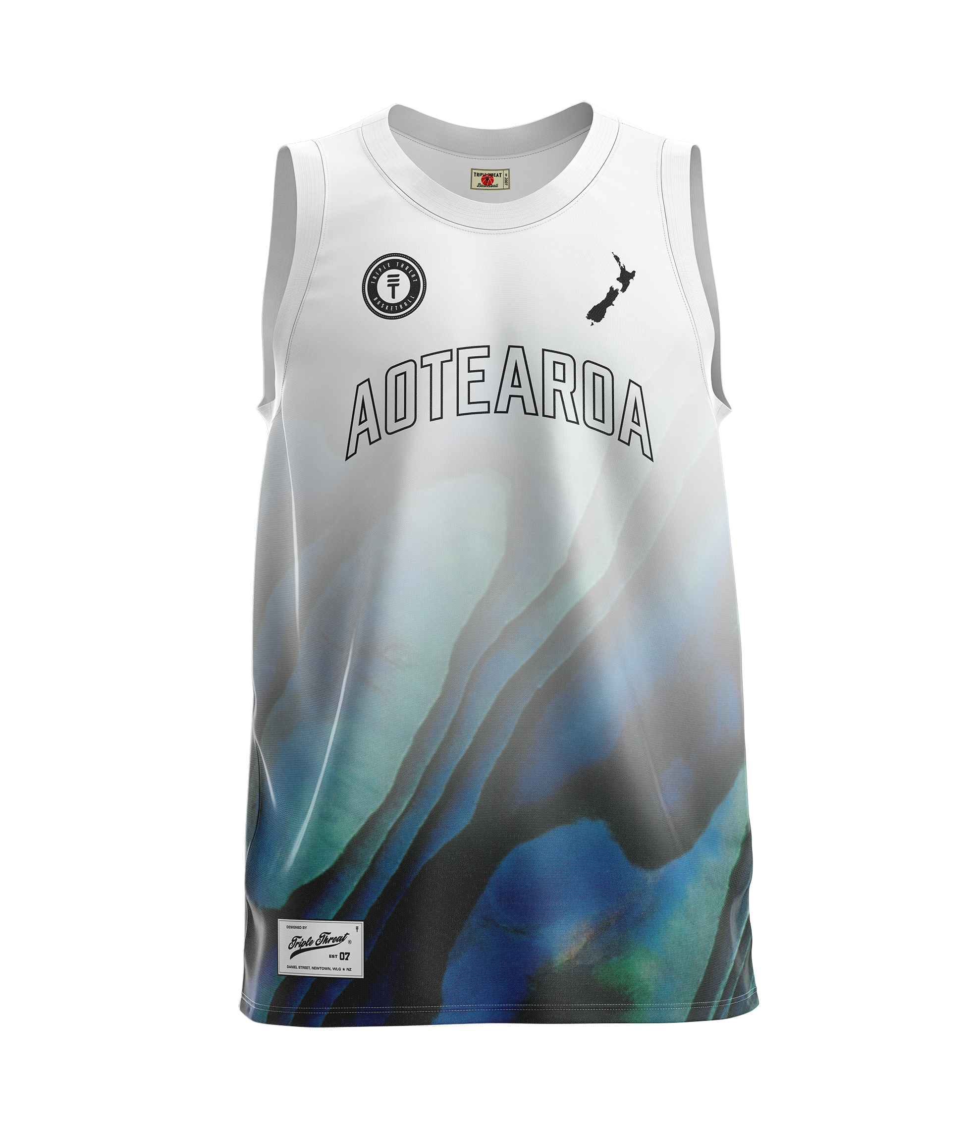 Kids white and paua design basketball singlet featuring a Triple Threat logo and NZ map design, with large text saying "Aotearoa" on the front center