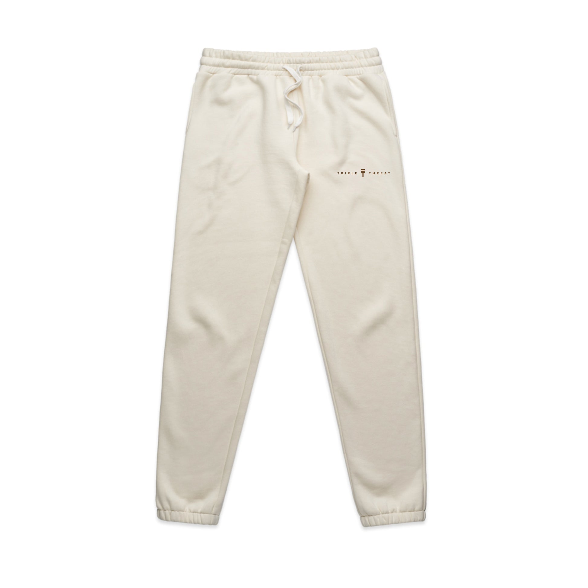 Cream track pants from Triple Threat with logo and name in brown and elastic waist and cuffs