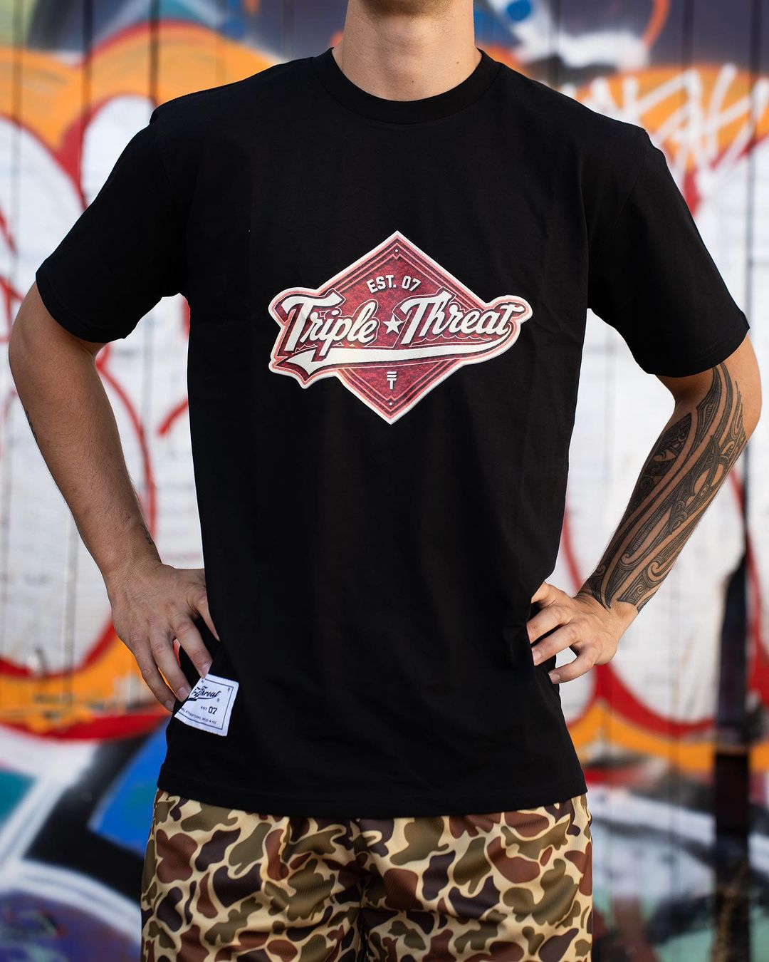 Model wearing Triple Threats Diamond T-shirt in black