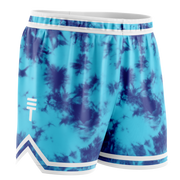 Blue and navy tie-dye basketball shorts with white trim, elastic waistband, and the Triple Threat logo near the hem