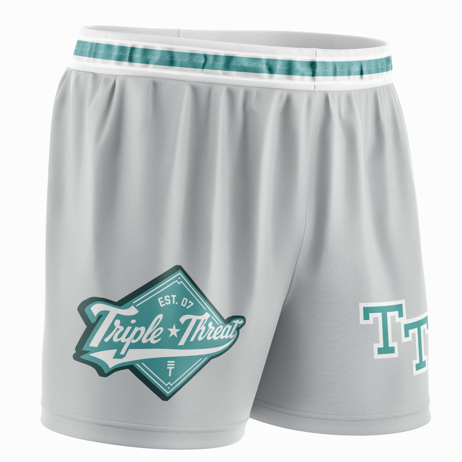 Grey basketball shorts with calligraphy "Triple Threat" around the waist inside teal strip, a teal and white diamond Triple Threat logo and "TT" 