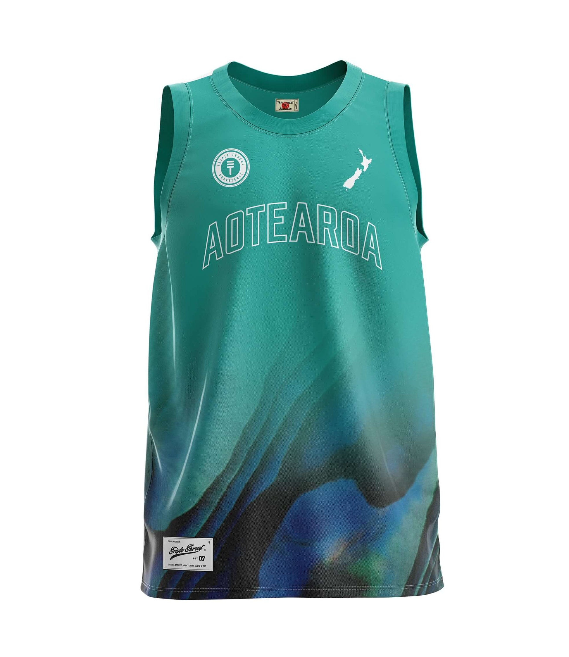 Kids basketball singlet by Triple Threat in Paua and Teal, features New Zealand map and "Aotearoa" on the front