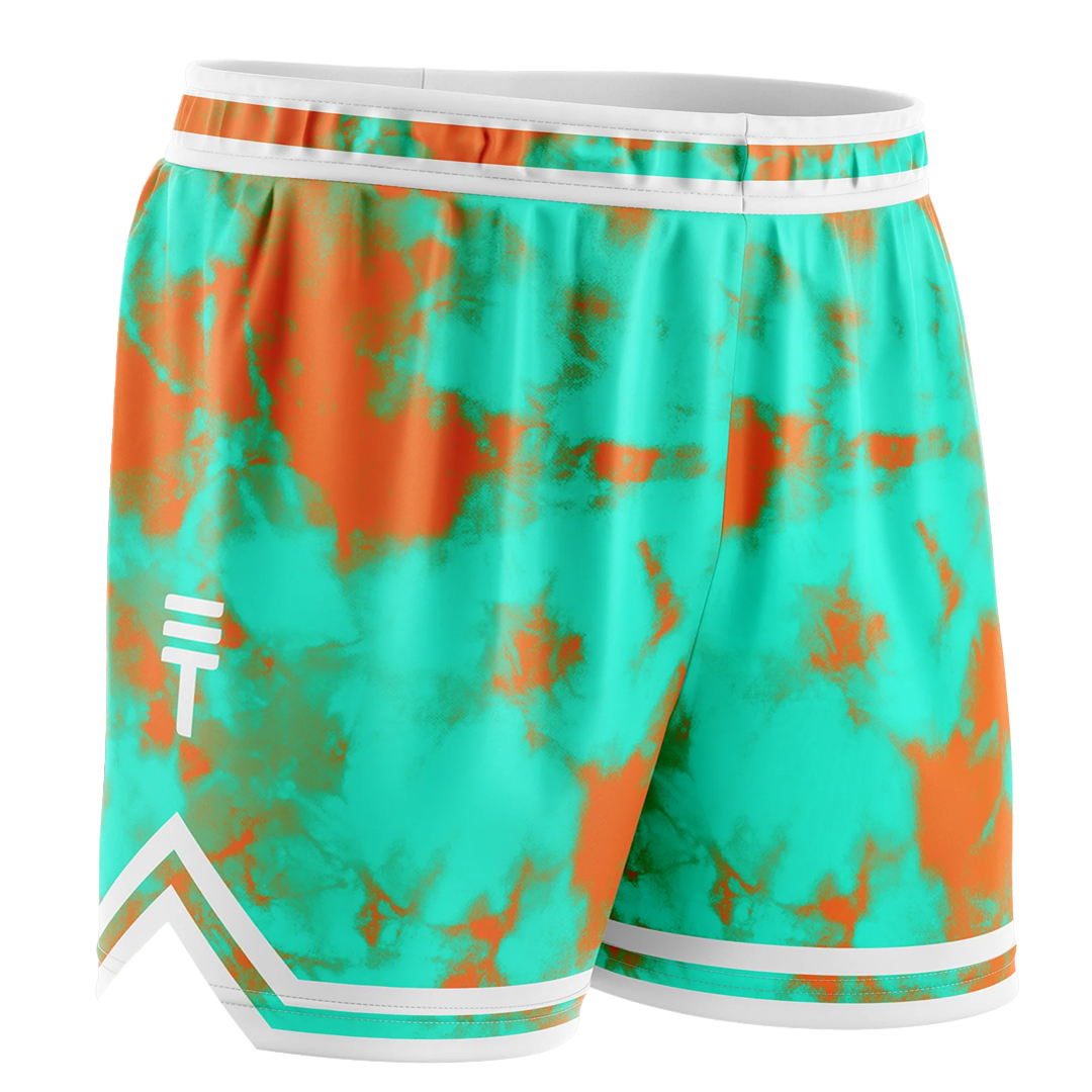 Kids orange and teal tie-dye shorts with an elastic waistband featuring a white trim and the Triple Threat logo on the right leg