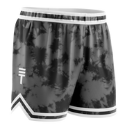 Black and grey tie-dye basketball shorts for kids with an elastic waistband and the Triple Threat logo in a diamond pattern