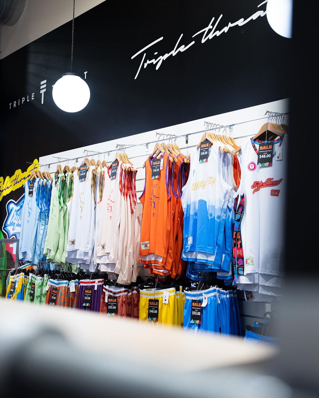 In-store photo showing Triple Threat products
