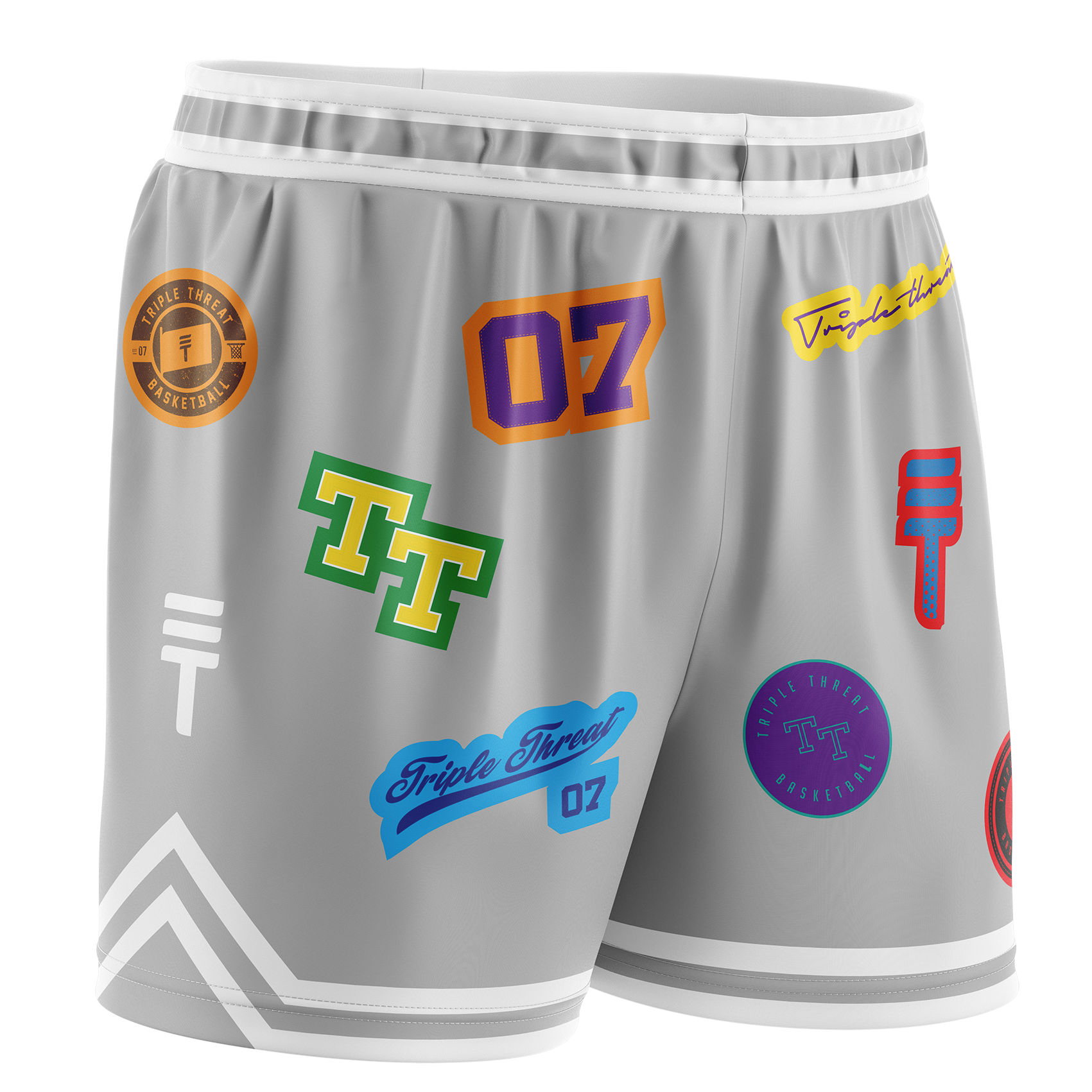Grey basketball shorts featuring various colourful logos and designs, with an elastic waistband, white trim, and the Triple Threat logo