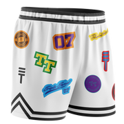 White basketball shorts featuring various colourful logos and designs, with an elastic waistband, black trim, and the Triple Threat logo
