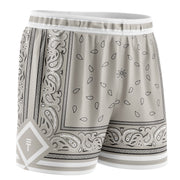 bone coloured basketball shorts with paisley design in black and white featuring a Triple Threat logo in white 