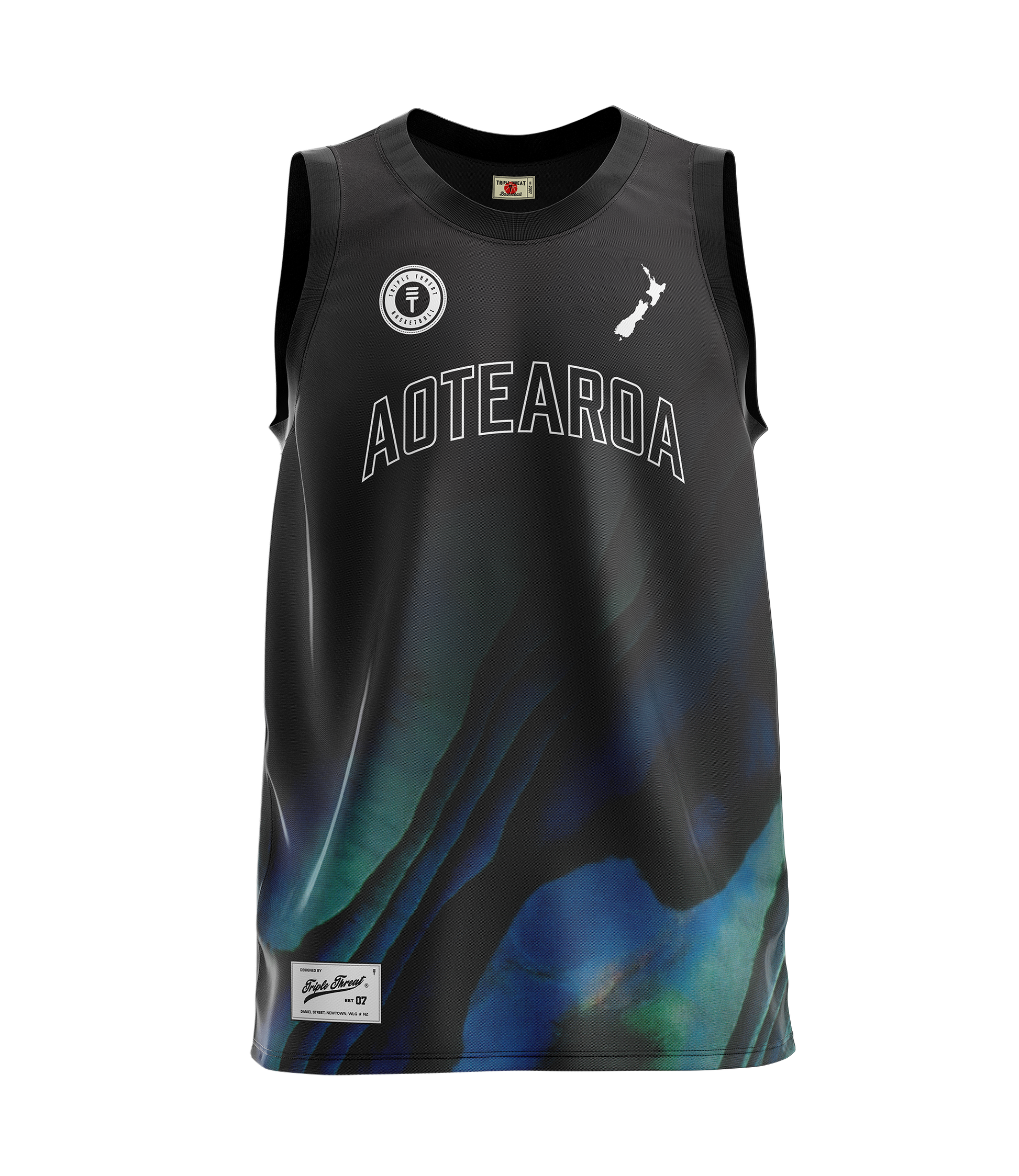 children's black basketball singlet with a paua design at the bottom  featuring "Aoteatora" as text, the New Zealand map and Triple Threat logo 