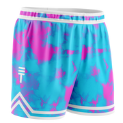 Kids blue and pink tie-dye basketball shorts with an elastic waistband and white trim, featuring the Triple Threat logo