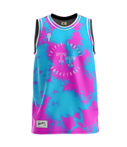 Kids tie-dye basketball singlet in blue and pink, featuring the Triple Threat logo on the top left and a stylish, breathable design perfect for both sports and casual wear 